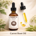 Bottle of carrot root oil with dropper and label on a natural background