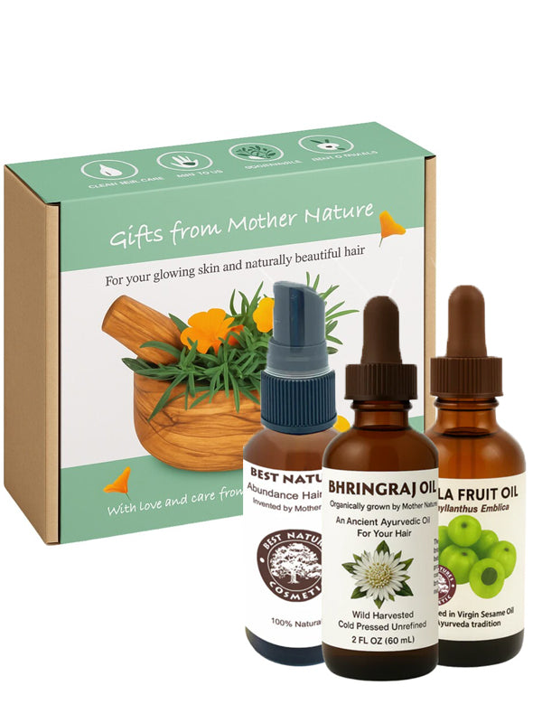 Three bottles of natural oils Amla, Bhrignraj, Hair Abundance with a 'Gifts from Mother Nature' box on a white background