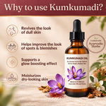 Kumkumadi oil bottle with benefits listed on a wooden surface with flowers and herbs.