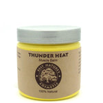 Jar of Thunder Heat Muscle Balm with a white lid on a white background